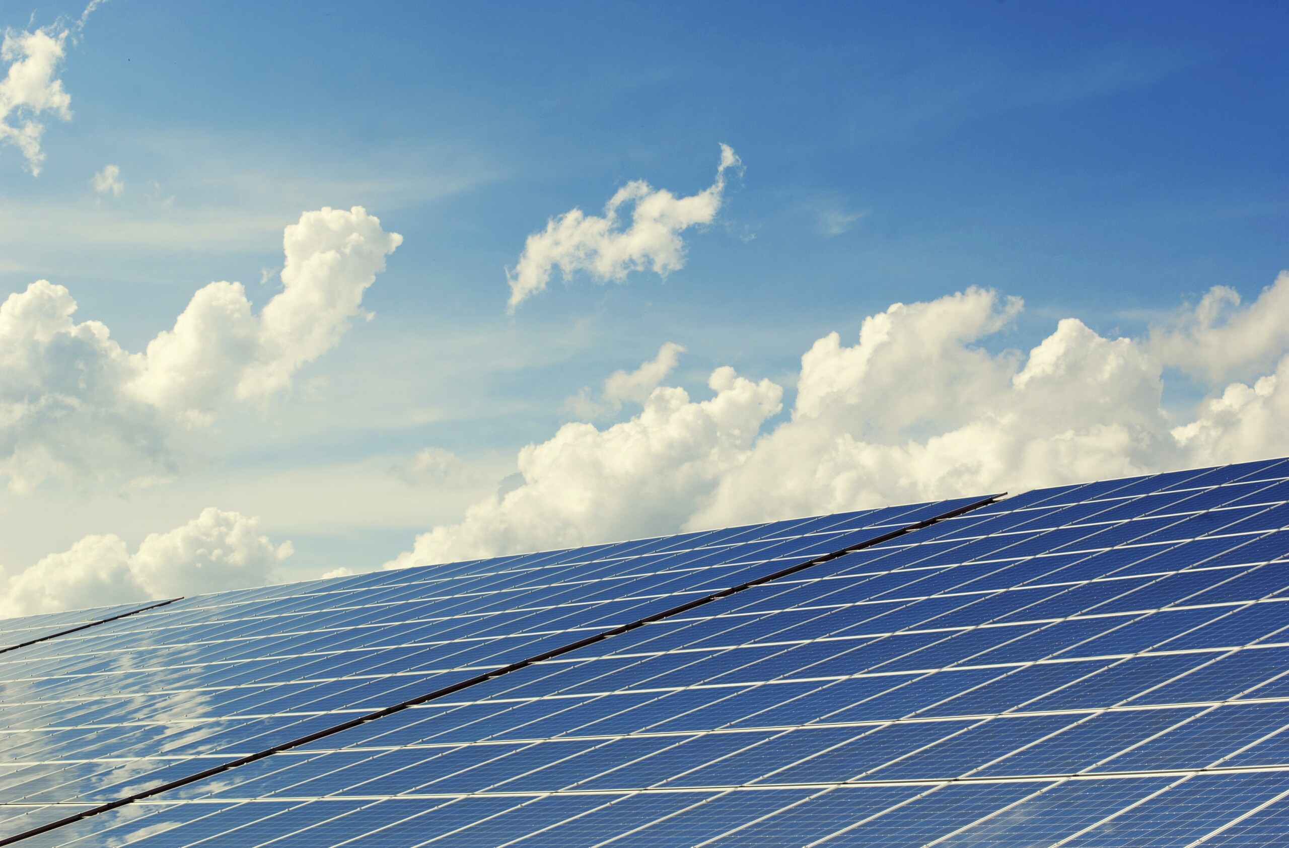 Solar panels with partly cloudy sky